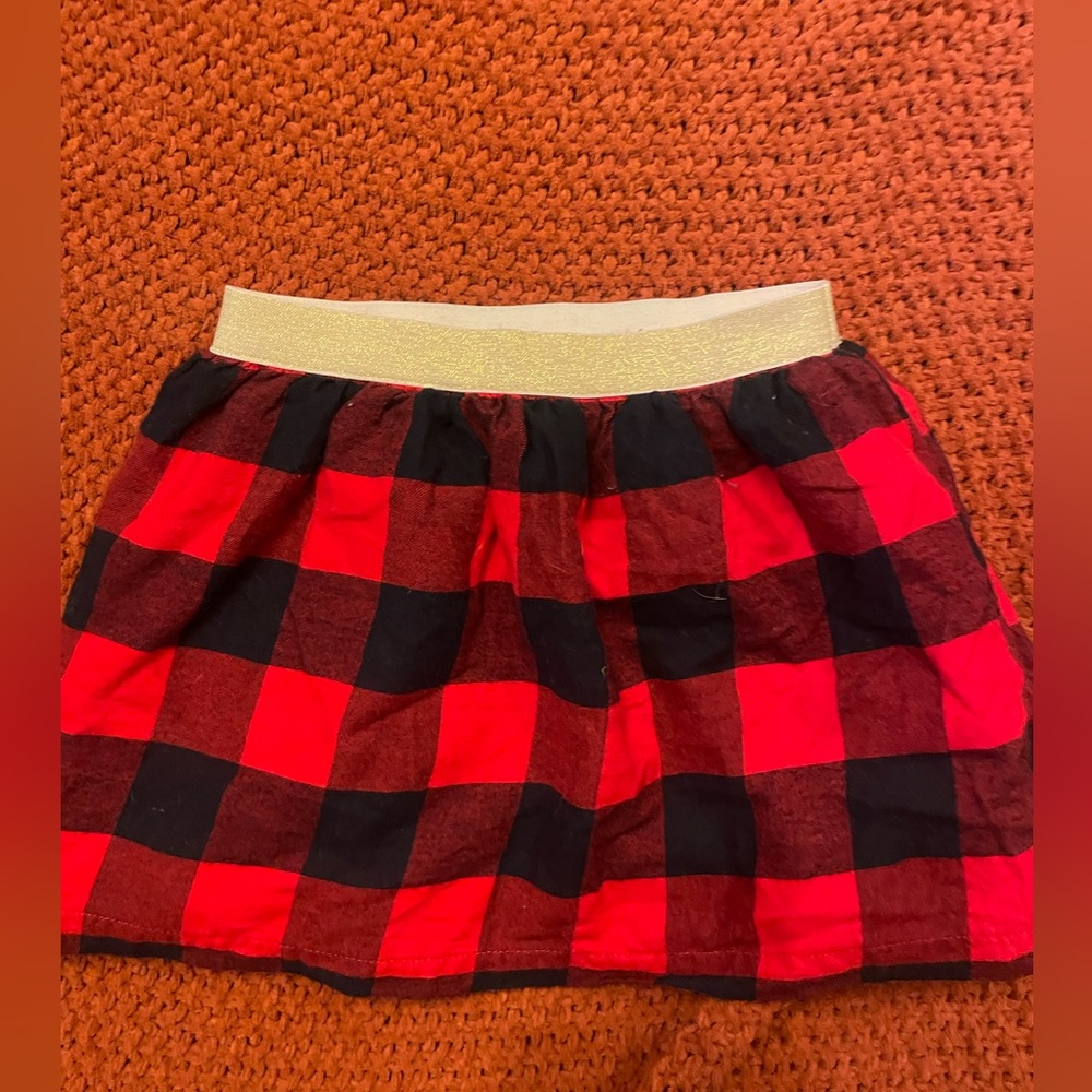Girls carters Buffalo plaid skirt, perfect for holiday photos.